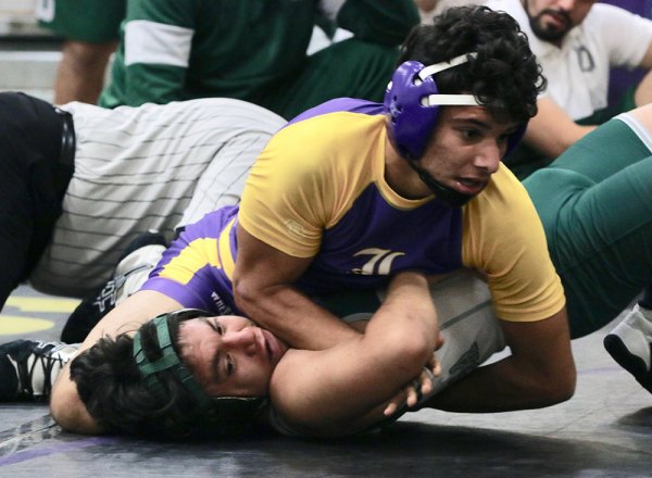Lemoore's Will Kloster help lead his varsity wrestling team to wins in the season-opening Lemoore Duals Wrestling Tournament.